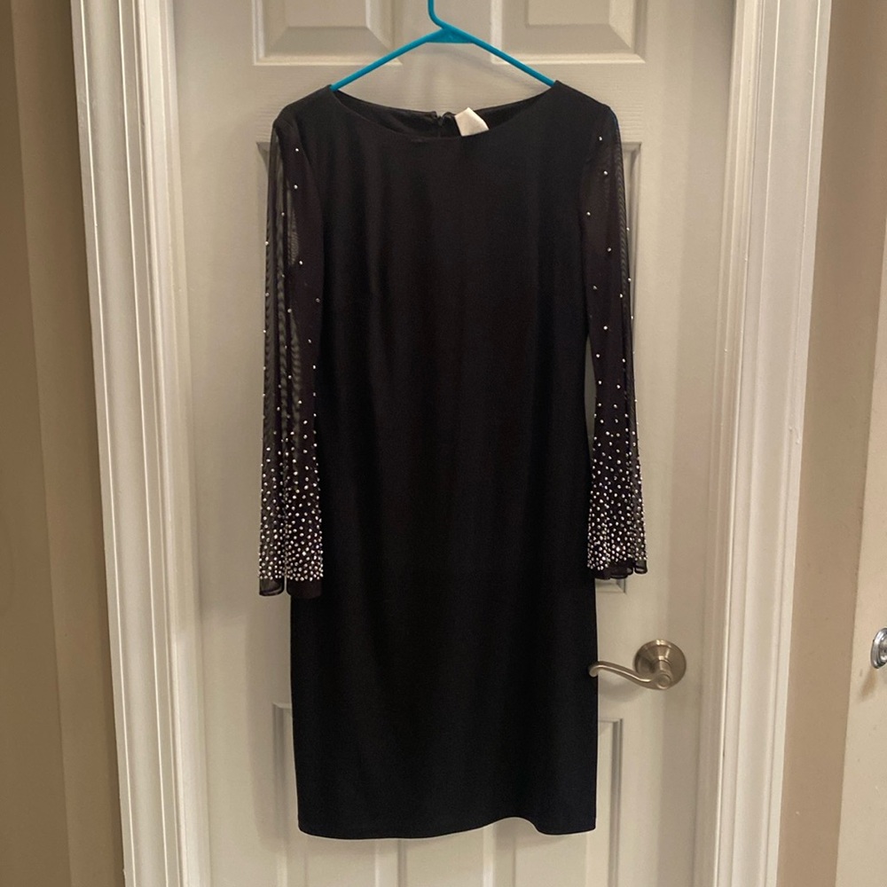 Black dress with beaded bell sleeves.
